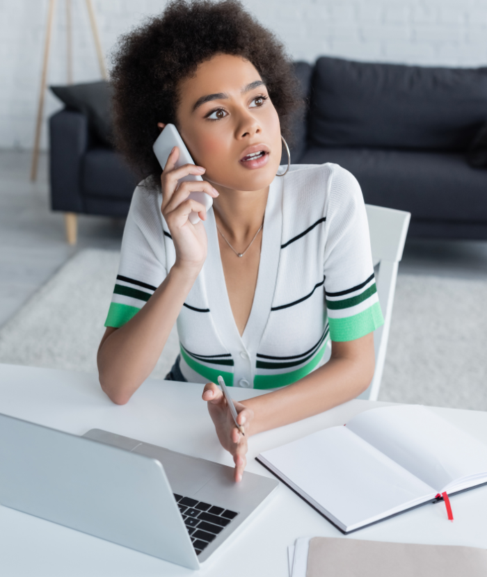 Person reviewing online banking statement on a laptop while concerned about digital fraud and financial loss from cybercrime
