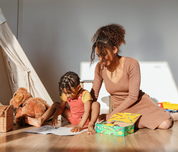 Mother caring for her son while balancing work and financial responsibilities in South Africa.